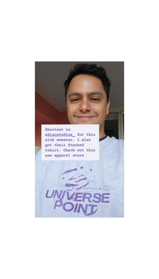 Sanjay Parker all smiles in our "Universe" crewneck